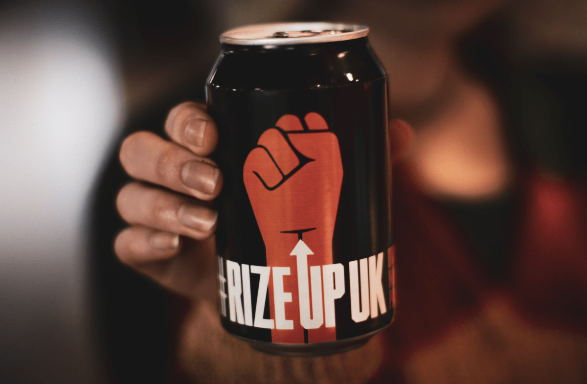 Rize Up can in hand